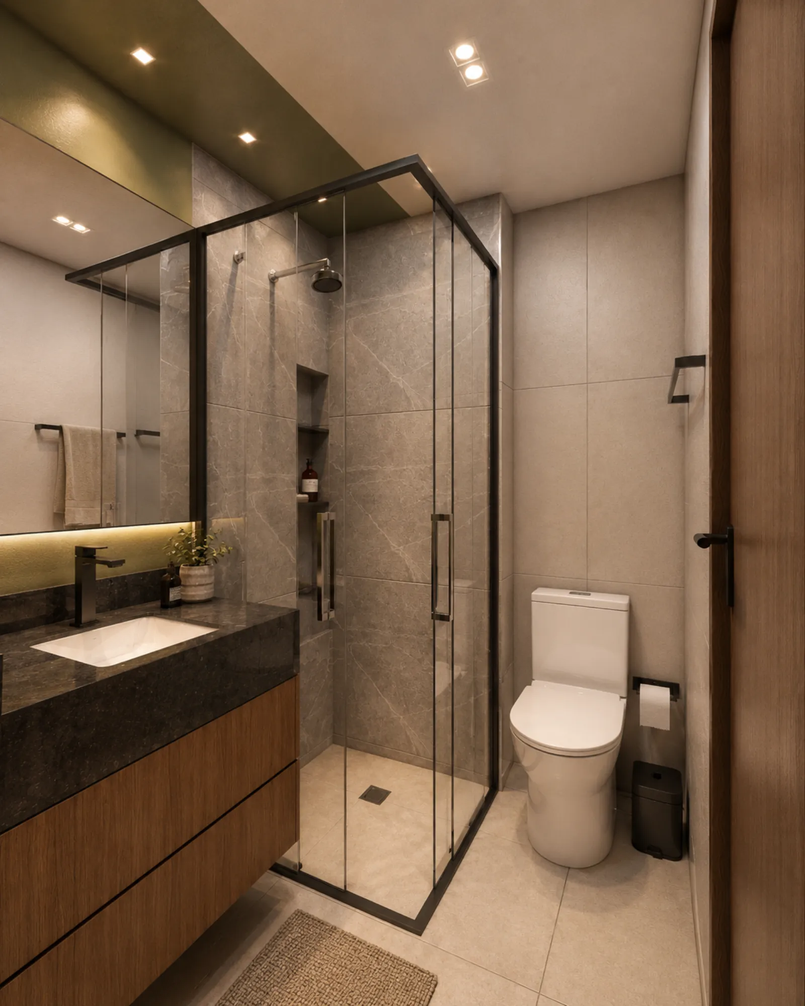 Banheiro do studio Stay Tibery com box, bancada ampla, espelho e marcenaria